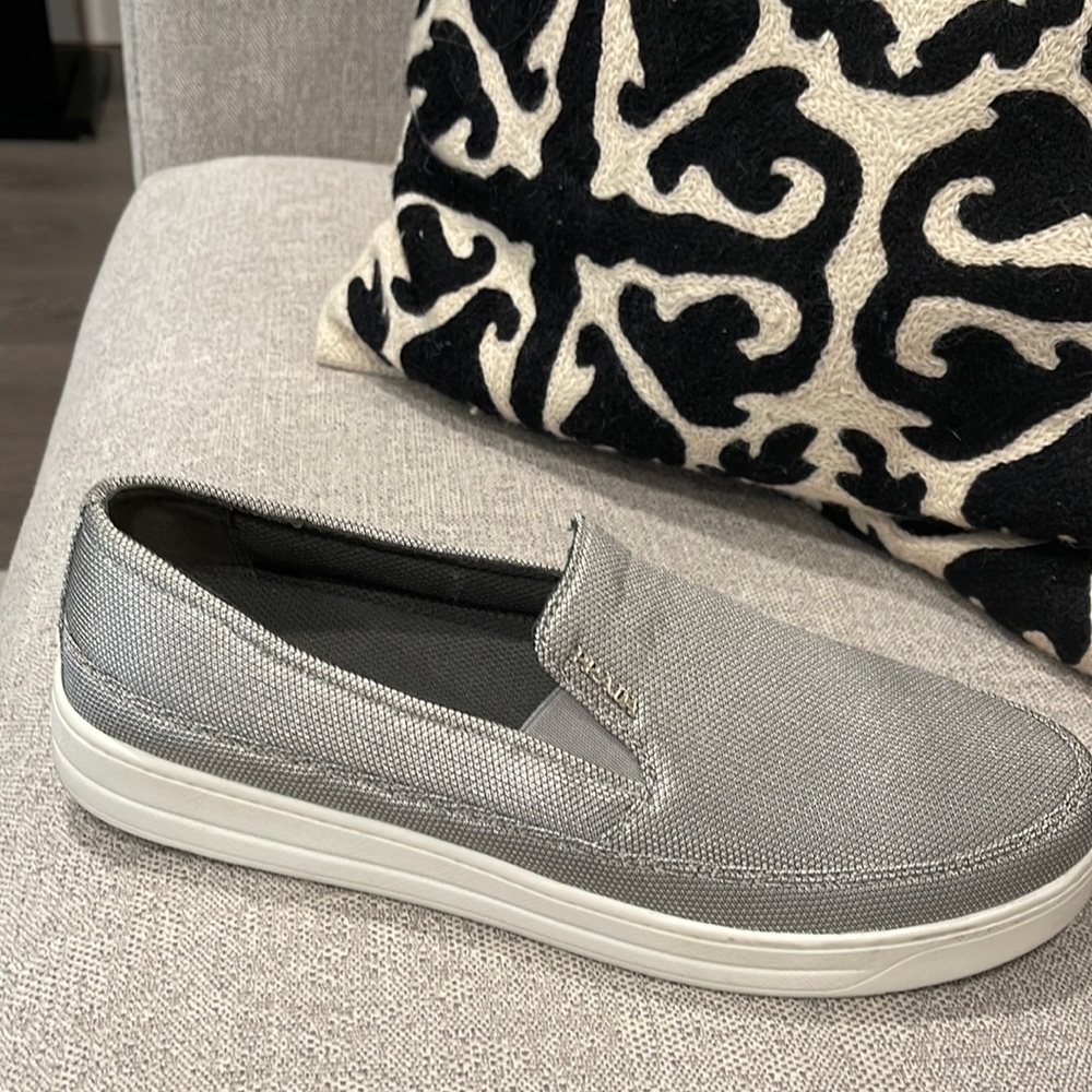 Prada Ladies Slip on sneakers. Silver/gray. Never worn. No tags.